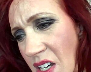 The fake tits on this raunchy redhead milf bounce around in this anal threesome