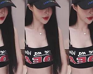 Chinese girl dances with slim toned body