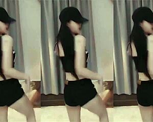 Chinese girl dances with slim toned body