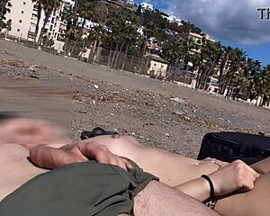 flashing cock next to topless girl on beach